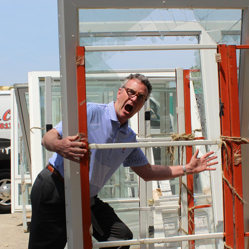 Man looking through window before installation